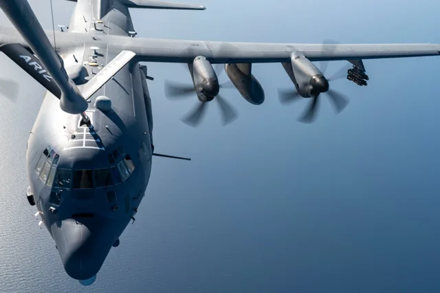 A U.S. Air Force AC-130J Ghostrider receiving fuel from a KC-135