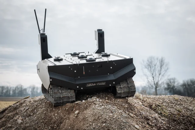 An ARX Robotics GEREON RCS tracked unmanned ground vehicle on an earthen mound