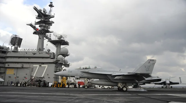 An F/A-18F Super Hornet landing on the deck of USS George H. W. Bush