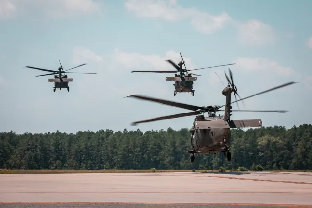 U.S. Army UH-60M Black Hawks lift off during training.