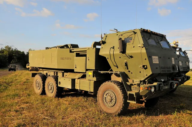 An M142 HIMARS launcher in a field during Exercise Saber Strike 18 in Poland