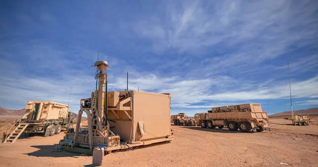 Integrated Battle Command System equipment and vehicles deployed at a desert test site