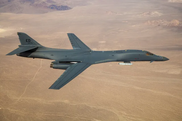 A B-1B Lancer carrying an AGM-158 JASSM externally over Edwards Air Force Base
