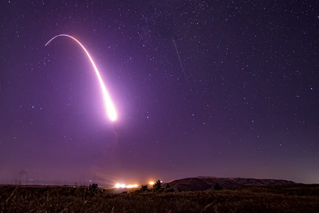 Long-exposure photograph of an unarmed Minuteman III test launch at night