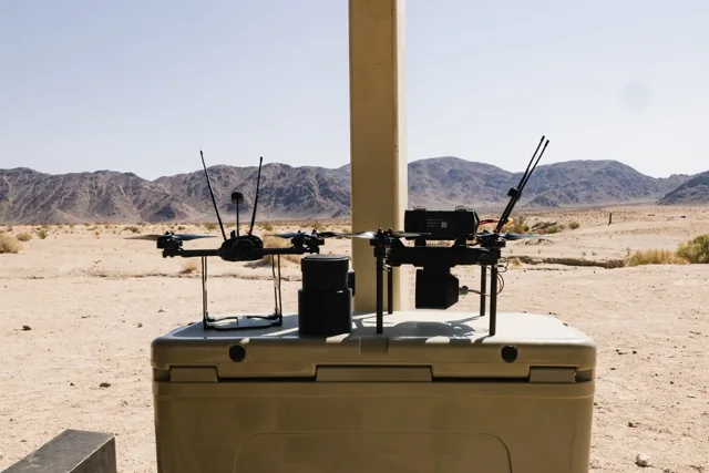 Two Neros Archer first-person-view training drones staged on an equipment case.