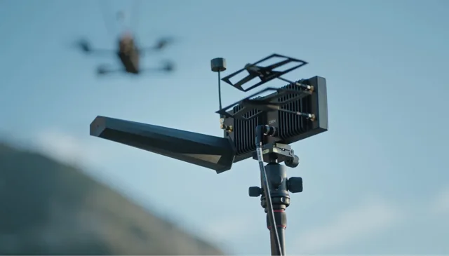 Neros Crossbow radio and antenna assembly with a drone in the background