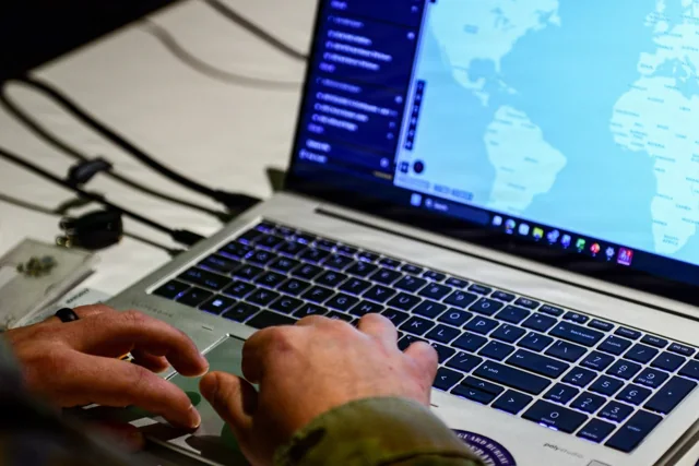 A National Guard Bureau officer using the Maven Smart System on a laptop