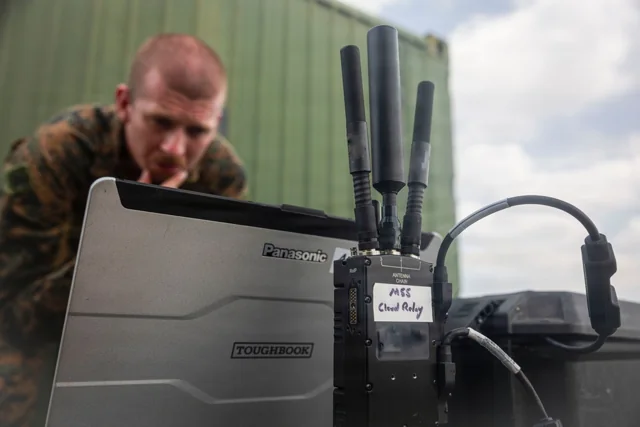 MPU5 radio beside a rugged laptop during Balikatan 2026.