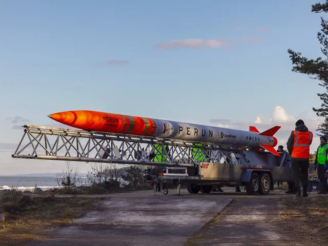 SpaceForest PERUN suborbital rocket on its transport and launch frame near the coast