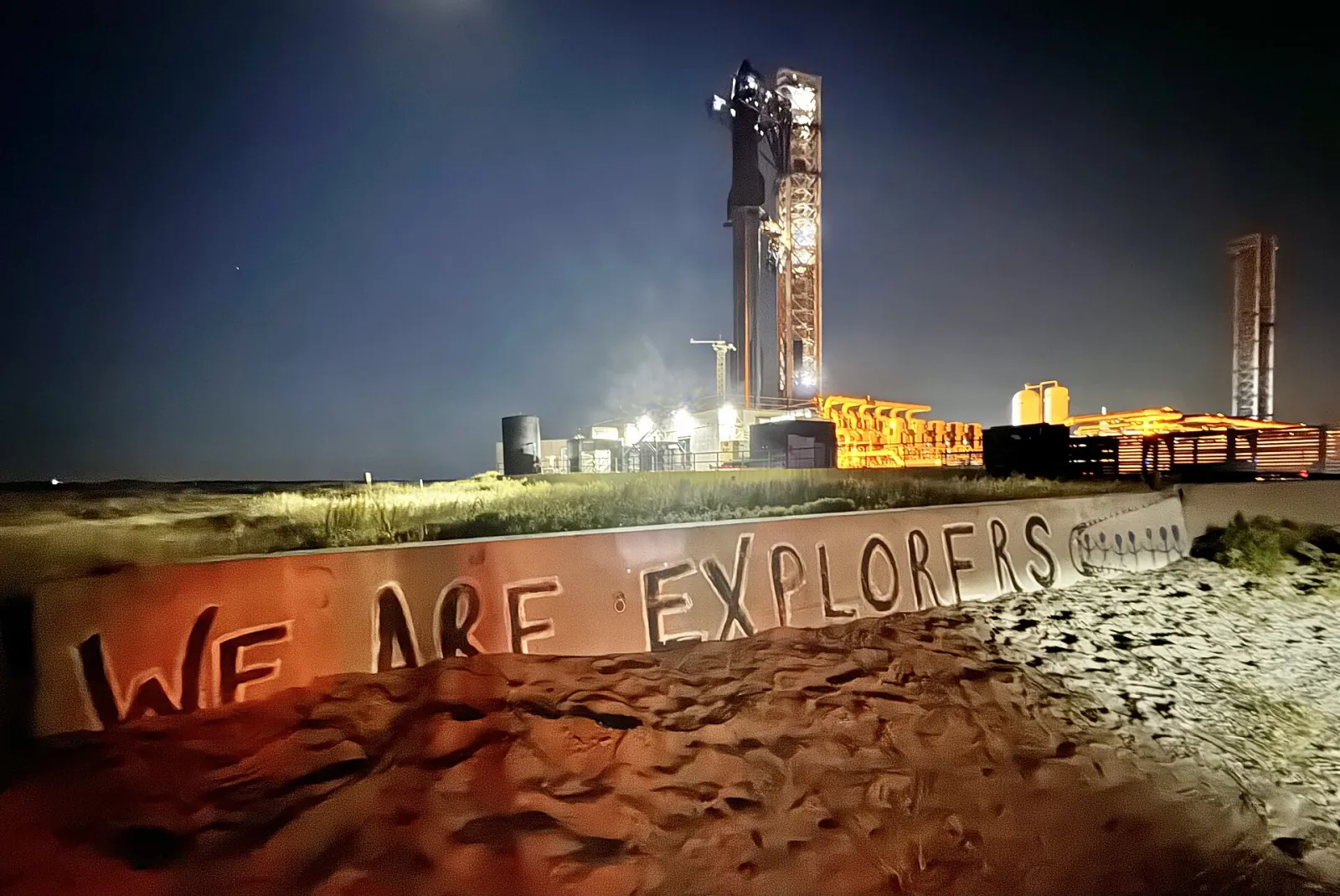 Starship stacked on its launch tower at Starbase, Texas, at night before Flight 5